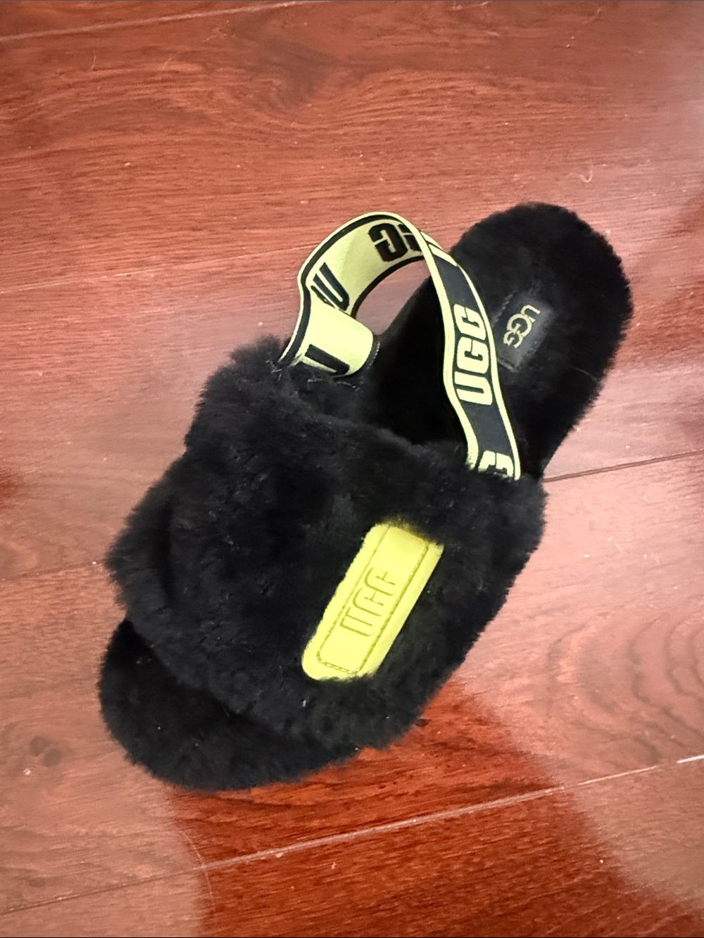UGG Black Faux-Fur Slide with Neon Yellow Logo Strap